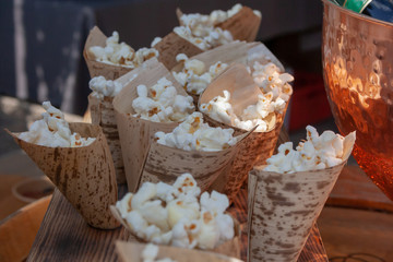 Popcorn in a paper bag displayed for sale on the street market