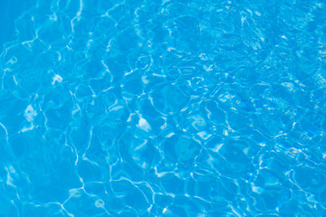 Naklejka na ściany i meble Blue water ripple reflection in the swimming pool