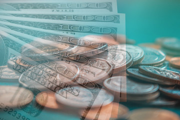 Stack of coins and US dollar banknotes,money,financial,saving money for retirement planning concept.