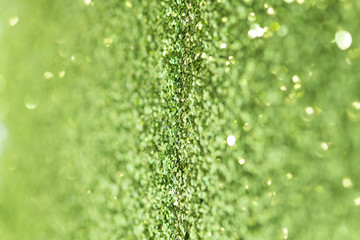 Shiny green glitter textured background