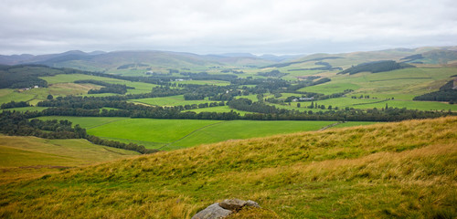 Obraz premium Farmland in Tweeddale from Cademuir Hill, near Peebles, Scottish Borders, Scotland, UK.