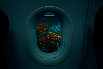 Night cityscape from airplane two window, Travel and tourism concept.