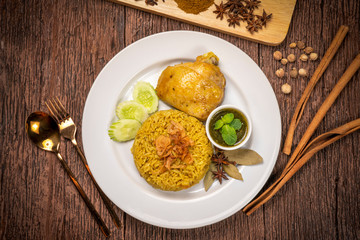 Delicious spicy chicken biryani on rustic wooden background, Chicken Biryani Thai style