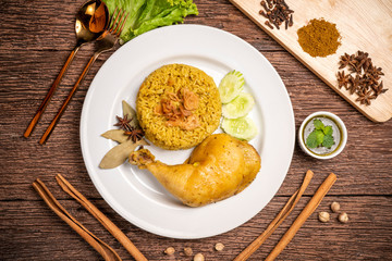 Delicious spicy chicken biryani on rustic wooden background, Chicken Biryani Thai style