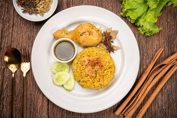 Delicious spicy chicken biryani on rustic wooden background, Chicken Biryani Thai style