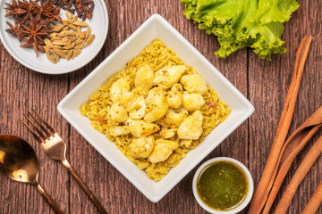 Yellow curried rice with crab, Thai yellow rice crab biryani with green coriander sauce