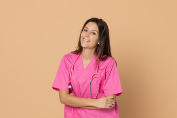 Young doctor with a pink uniform