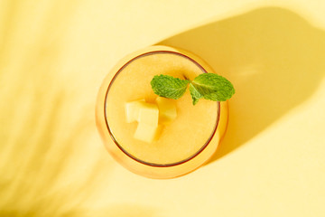 Layered mango and strawberry smoothie