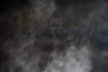 Black and white abstract smoke on a dark background
