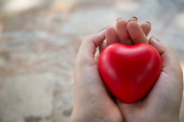 Woman hold red heart