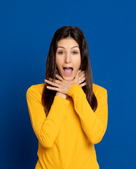 Brunette young woman wearing a yellow T-shirt