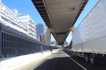 White truck driving on Tokyo Metropolitan Expressway