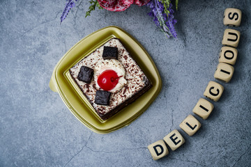 birthday or wedding chocolate and cherry cake so delicious on mable background with beatiful flowers