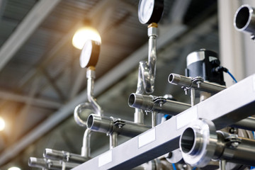 Distribution system of ball valves and metal pipelines and manometers. Equipment for the food industry.