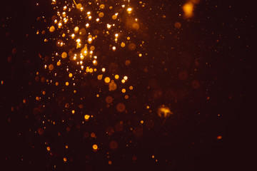 Fototapeta na wymiar Abstract gold defocus bokeh glitter vintage lights with black