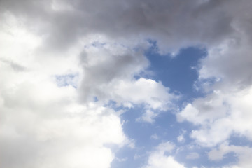 Obraz premium Clouds in the blue sky. A beautiful clouds against the blue sky background. Beautiful cloud pattern in the sky.