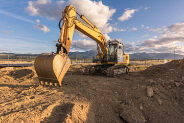 Excavator stopped due to the economic crisis in construction