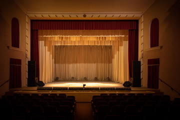 Theatrical scene without actors, scenic light, curtain and smoke