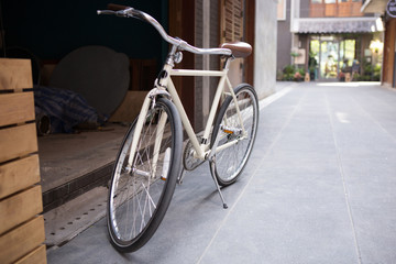Fototapeta na wymiar a bicycle in front of warehouse doorway