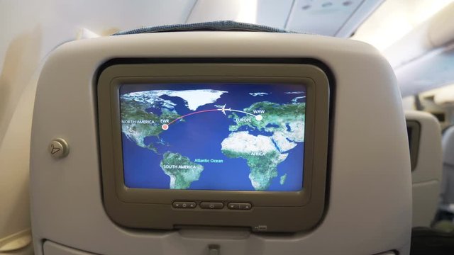 Travel map on airplane board during the flight in 4K Slow motion 60fps
