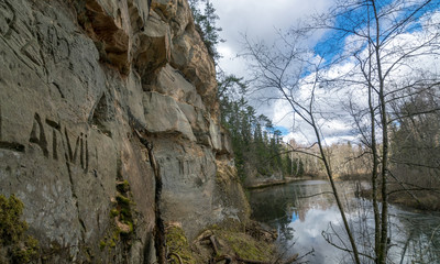 Fototapeta na wymiar landscape with sandstone cliff on the river bank