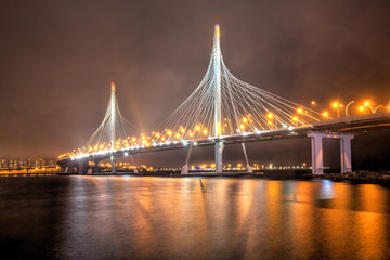 Obraz premium St. Petersburg, Russia - View of the night cable-stayed bridge in St. Petersburg. Illuminated night bridge