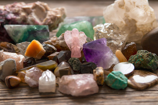 Collection of natural stones on a wooden background.