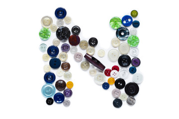 Letter N design made from clothing elements.