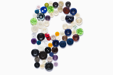 Letter P design made from clothing elements.