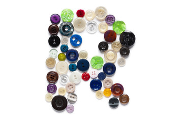 Letter R design made from clothing elements.