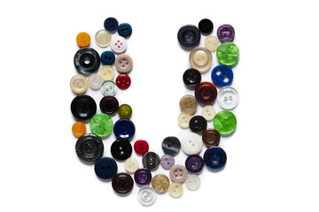 Letter U design made from clothing elements.