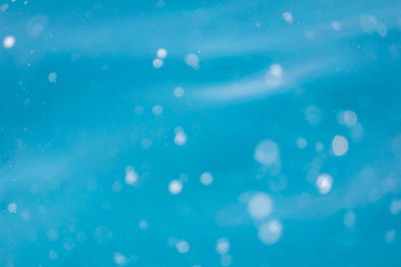 Bursts of waves in the sea. Drops and streaks of water for the background.