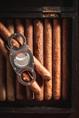 Top view of cigars in rustic wooden box