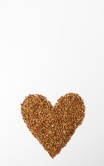 Heart shaped buckwheat on a white background