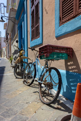Fototapeta na wymiar Greece Rhodes, 11/07/2018 : Walk around the old town. Bicycles against the wall with beautiful styling.