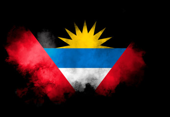 Antigua and Barbuda flag performed from color smoke on the black background. Abstract symbol.