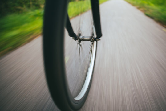 Blurred Motion Of Bicycle Wheel On Road