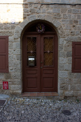 Greece Rhodes, 11/07/2018 : The old fortress of the island. Entrance wooden door in the old part of the city.