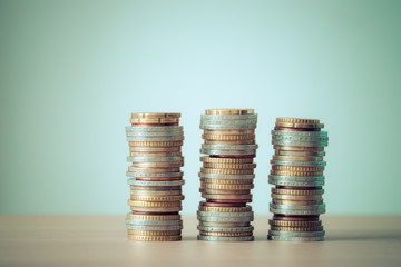 Money concept: Coins tacked on each other. Inflation, currency, savings, money