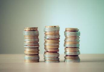 Market crisis and financial aid concept: Coins tacked on each other. Inflation, currency, savings, money