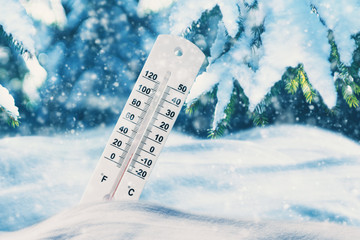 Low Temperature White Thermometer in Snow Dunes. Frozen Winter Landscape.