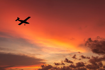 Fototapeta na wymiar airplane in the sunset