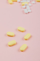 Obraz na płótnie Canvas Medicine and pills on a pink background