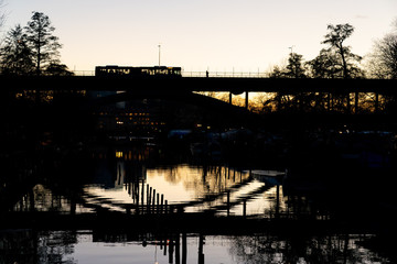 STOCKHOLM, SWEDEN; March 21 2019: Urban magical reflections in Swedish sunset. Långholmsbron...