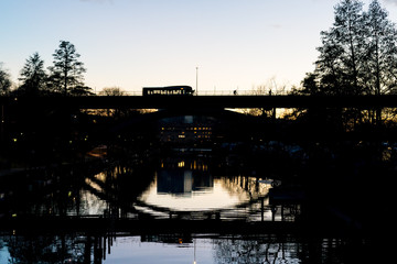 STOCKHOLM, SWEDEN; March 21 2019: Urban magical reflections in Swedish sunset. Långholmsbron...