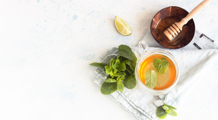 Glass mugs with traditional moroccan mint tea with honey and lime. Organic aromatherapy relaxation medical healthy beverage. Top view.