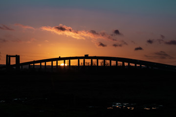 Fototapeta na wymiar Sunset under a road bridge in England