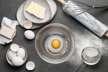 Ingredients for dough on dark background
