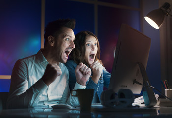 Cheerful couple connecting online