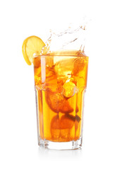 Glass of tasty cold ice tea with splash on white background